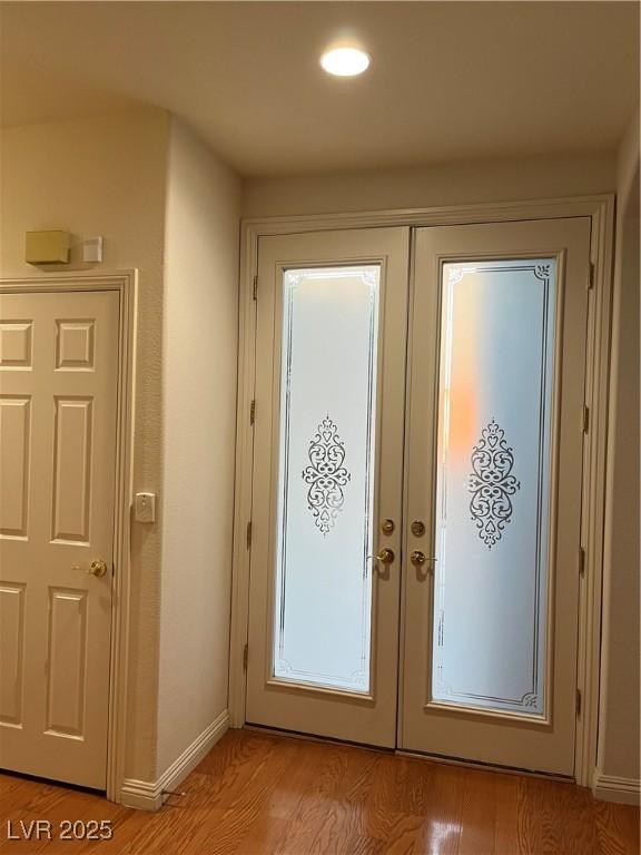 5049 Alfingo St, Las Vegas, NV 89135 - entrance foyer with french doors, baseboards, light wood-style floors, and recessed lighting