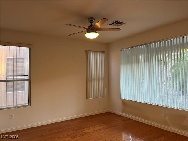 5049 Alfingo St, Las Vegas, NV 89135 - spare room featuring baseboards, wood finished floors, and ceiling fan