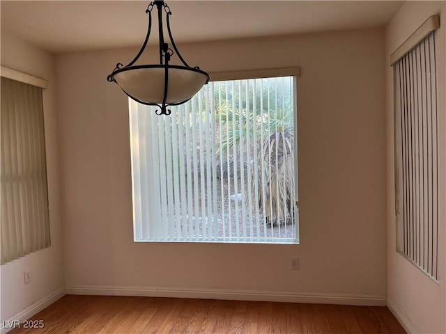 5049 Alfingo St, Las Vegas, NV 89135 - unfurnished dining area featuring plenty of natural light, baseboards, and light wood finished floors