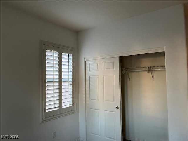 5049 Alfingo St, Las Vegas, NV 89135 - unfurnished bedroom featuring multiple windows and a closet