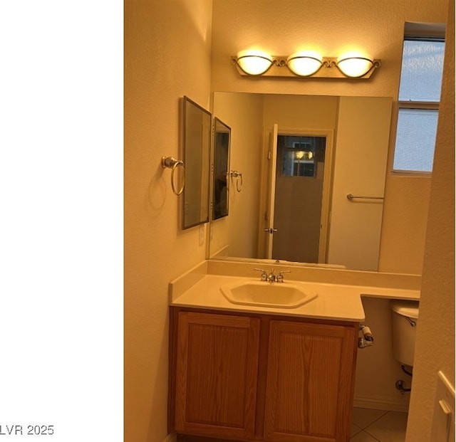 5049 Alfingo St, Las Vegas, NV 89135 - bathroom featuring vanity, tile patterned flooring, and toilet