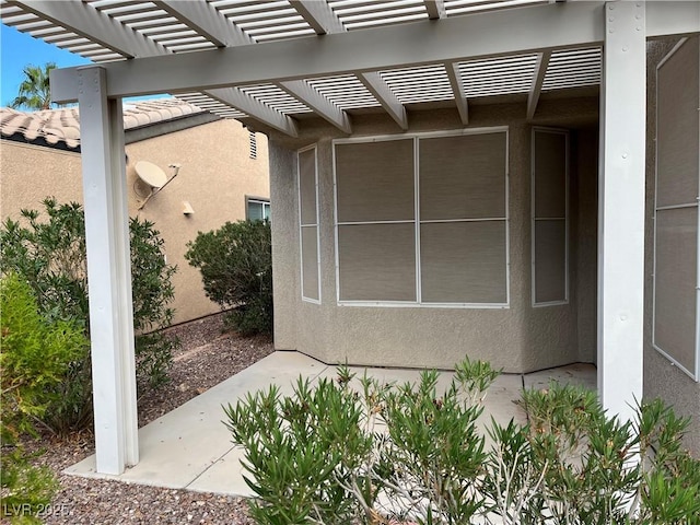 5049 Alfingo St, Las Vegas, NV 89135 - view of property exterior with stucco siding and a pergola