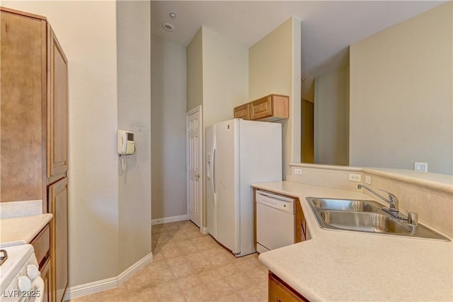 5552 Dueces Wild Ct Unit 101, Las Vegas, NV 89122 - kitchen featuring white appliances, a sink, and light countertops