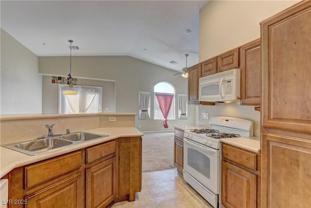 5552 Dueces Wild Ct Unit 101, Las Vegas, NV 89122 - kitchen with white appliances, a sink, vaulted ceiling, and light countertops