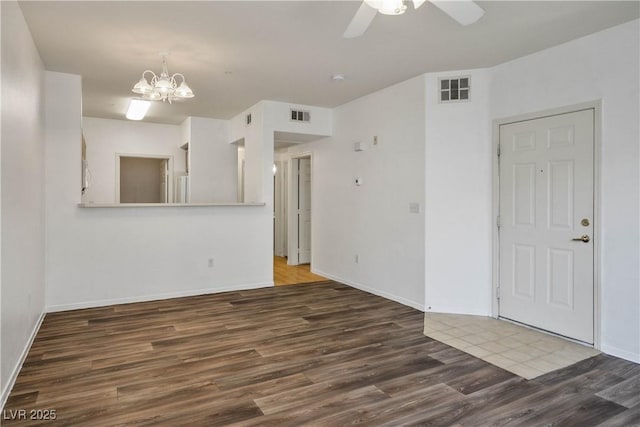 7143 S Durango Dr Unit 202, Las Vegas, NV 89113 - unfurnished room with wood finished floors, a chandelier, baseboards, and a ceiling fan