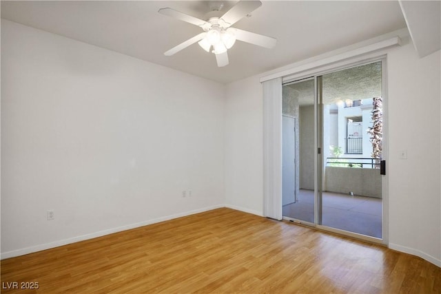 7143 S Durango Dr Unit 202, Las Vegas, NV 89113 - unfurnished room featuring light wood-style flooring, baseboards, and a ceiling fan