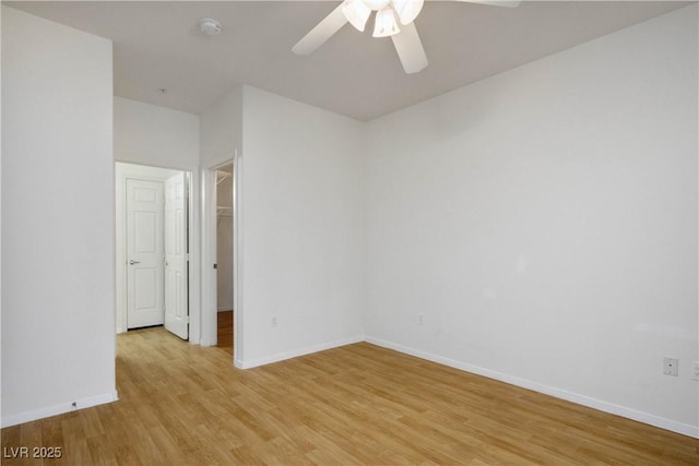 7143 S Durango Dr Unit 202, Las Vegas, NV 89113 - spare room featuring a ceiling fan, a smoke detector, light wood finished floors, and baseboards