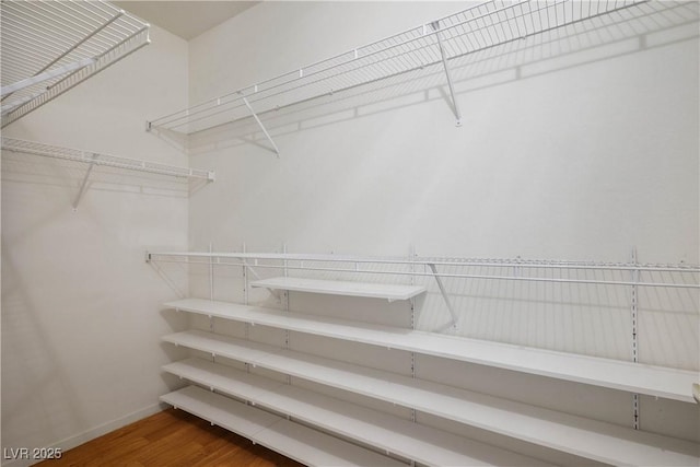 7143 S Durango Dr Unit 202, Las Vegas, NV 89113 - spacious closet featuring wood finished floors