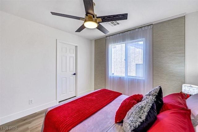 9078 Hilverson Ave, Las Vegas, NV 89148 - bedroom with wood finished floors, baseboards, and a ceiling fan