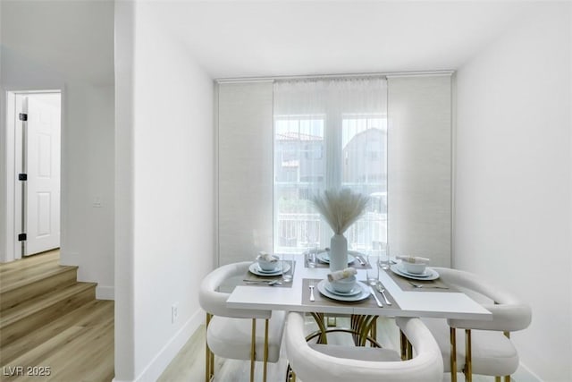 9078 Hilverson Ave, Las Vegas, NV 89148 - dining space featuring light wood-style flooring and baseboards