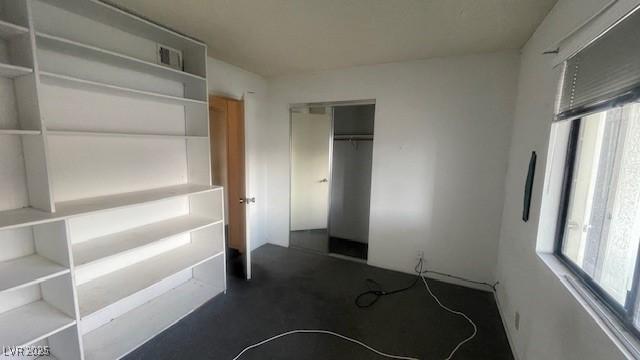 1701 E Katie Ave Unit 91, Las Vegas, NV 89119 - unfurnished bedroom with multiple windows and a closet
