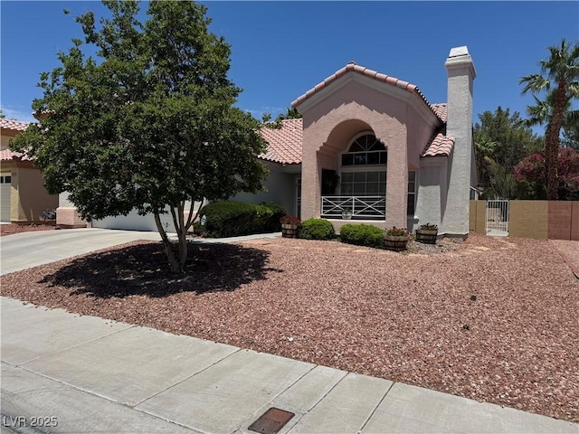 2904 Channel Bay Dr, Las Vegas, NV 89128 - mediterranean / spanish home with a tiled roof, stucco siding, a gate, driveway, and a chimney