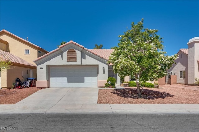 2904 Channel Bay Dr, Las Vegas, NV 89128 - view of front of property featuring a garage, concrete driveway, stucco siding, and a tiled roof
