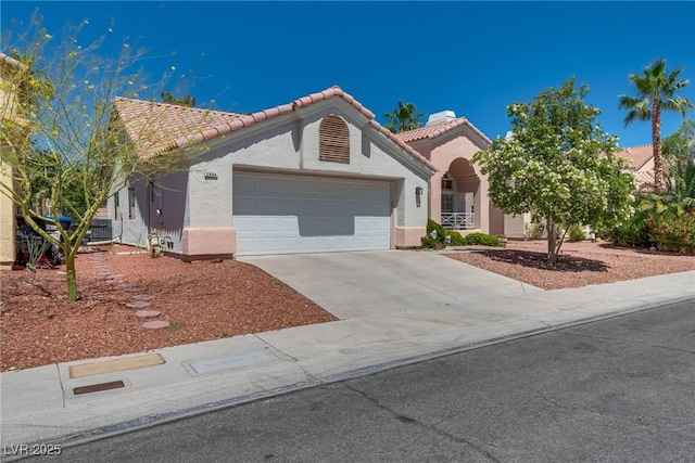2904 Channel Bay Dr, Las Vegas, NV 89128 - mediterranean / spanish-style house featuring stucco siding, an attached garage, driveway, and a tile roof