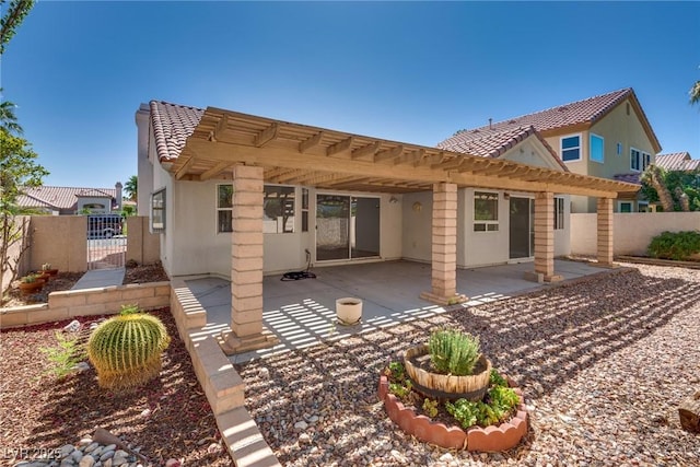 2904 Channel Bay Dr, Las Vegas, NV 89128 - back of house with stucco siding, a tile roof, a gate, a pergola, and a patio area