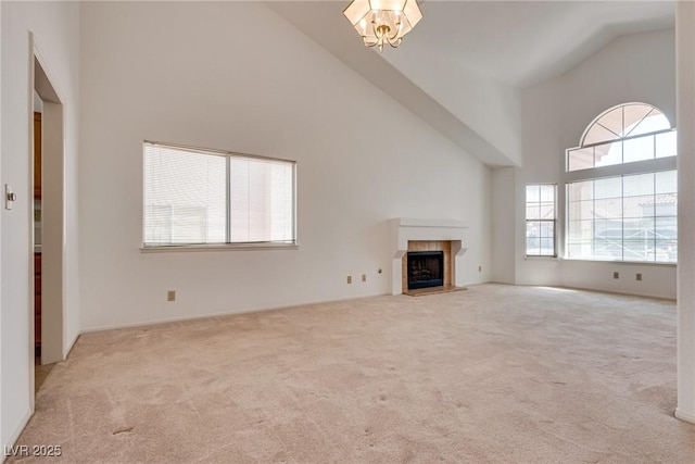 2904 Channel Bay Dr, Las Vegas, NV 89128 - unfurnished living room with high vaulted ceiling, carpet floors, and a tiled fireplace