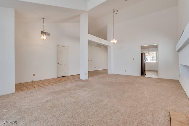 2904 Channel Bay Dr, Las Vegas, NV 89128 - unfurnished living room featuring carpet flooring and high vaulted ceiling