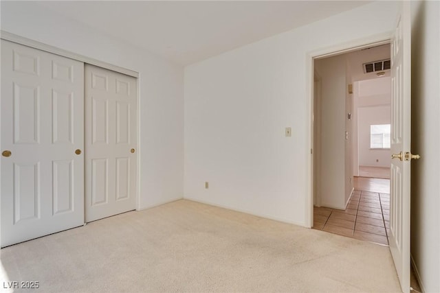 2904 Channel Bay Dr, Las Vegas, NV 89128 - unfurnished bedroom featuring carpet, a closet, and tile patterned floors
