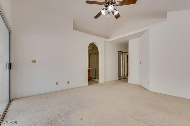 2904 Channel Bay Dr, Las Vegas, NV 89128 - spare room with light carpet, arched walkways, ceiling fan, and vaulted ceiling