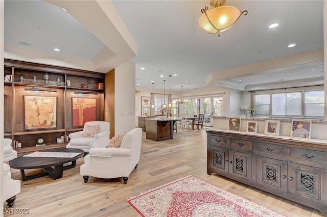 748 Puerto Real Ct, Las Vegas, NV 89138 - living room featuring light wood finished floors, a tray ceiling, and recessed lighting