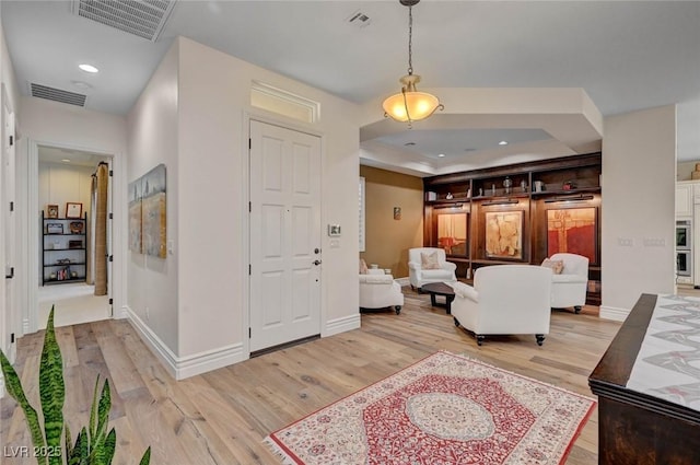 748 Puerto Real Ct, Las Vegas, NV 89138 - foyer entrance featuring light wood-style floors, baseboards, recessed lighting, and a tray ceiling