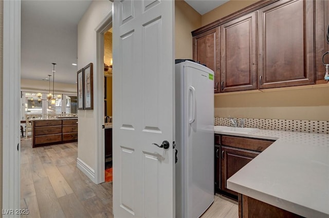 748 Puerto Real Ct, Las Vegas, NV 89138 - washroom with cabinet space, light wood finished floors, and recessed lighting