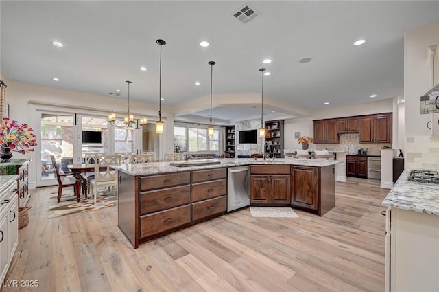748 Puerto Real Ct, Las Vegas, NV 89138 - kitchen with light wood-type flooring, appliances with stainless steel finishes, recessed lighting, decorative backsplash, and a sink