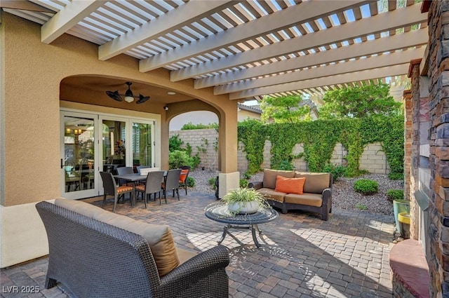 748 Puerto Real Ct, Las Vegas, NV 89138 - fenced backyard with an outdoor living space, outdoor dining space, a patio area, french doors, and a pergola