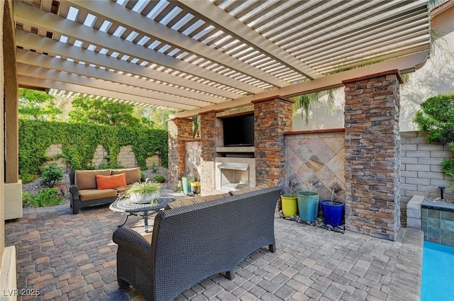 748 Puerto Real Ct, Las Vegas, NV 89138 - fenced backyard with a patio area and an outdoor living space with a fireplace
