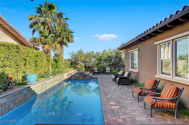 748 Puerto Real Ct, Las Vegas, NV 89138 - view of swimming pool with a patio area and a pool with connected hot tub