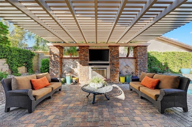 748 Puerto Real Ct, Las Vegas, NV 89138 - view of patio / terrace with an outdoor living space with a fireplace and a pergola
