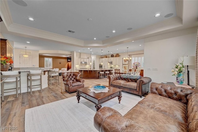 748 Puerto Real Ct, Las Vegas, NV 89138 - living room with a tray ceiling, light wood finished floors, ornamental molding, and recessed lighting