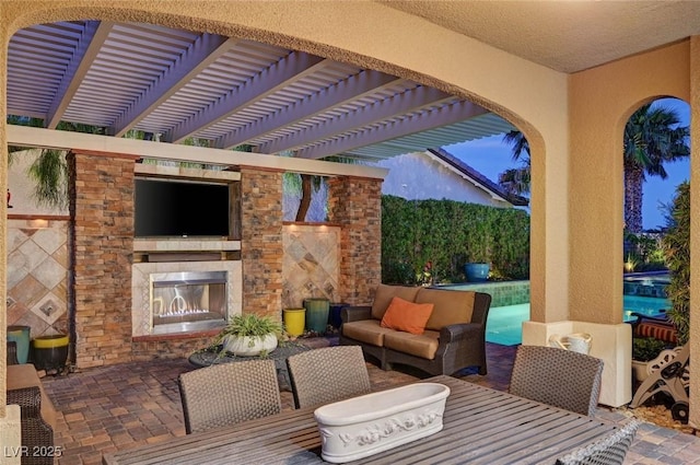 748 Puerto Real Ct, Las Vegas, NV 89138 - view of patio featuring an outdoor living space with a fireplace and a pergola