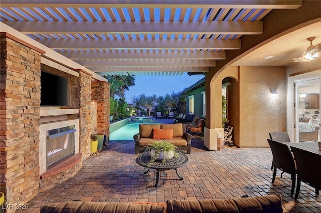 748 Puerto Real Ct, Las Vegas, NV 89138 - view of patio / terrace featuring an outdoor living space with a fireplace and an outdoor pool