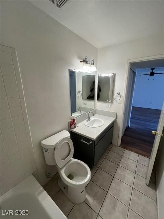 3585 Arville St Unit 403A, Las Vegas, NV 89103 - full bathroom featuring tile patterned flooring, toilet, vanity, and a tub