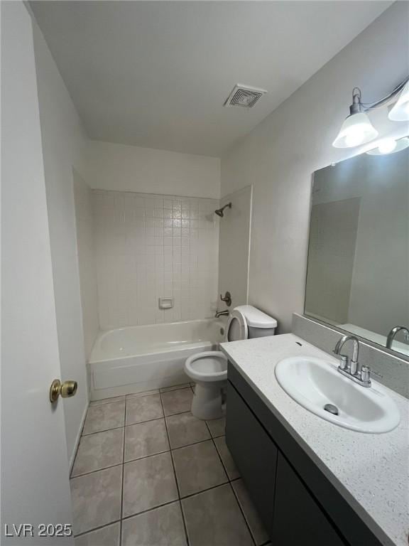 3585 Arville St Unit 403A, Las Vegas, NV 89103 - bathroom with tile patterned floors, vanity, toilet, and bathing tub / shower combination
