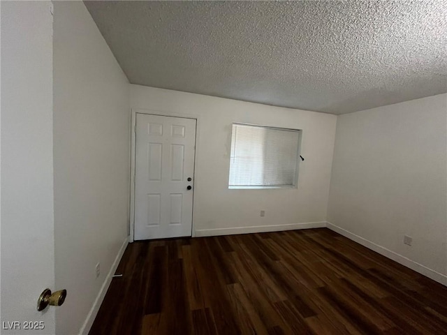 3585 Arville St Unit 403A, Las Vegas, NV 89103 - empty room featuring wood finished floors, a textured ceiling, and baseboards