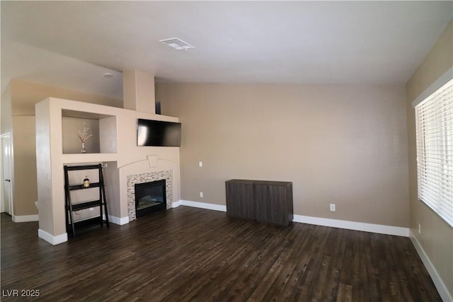 878 Samoy St, Las Vegas, NV 89110 - unfurnished living room with dark wood-type flooring, a fireplace, and baseboards