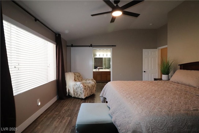 878 Samoy St, Las Vegas, NV 89110 - bedroom featuring dark wood finished floors, baseboards, lofted ceiling, ensuite bath, and a barn door