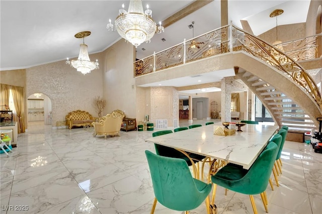 2131 Diamond Bar Dr, Las Vegas, NV 89117 - dining area featuring a chandelier, arched walkways, a towering ceiling, marble tiled floors, and stairs