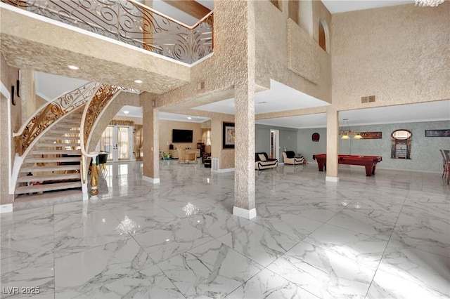 2131 Diamond Bar Dr, Las Vegas, NV 89117 - community lobby featuring a high ceiling and stairs