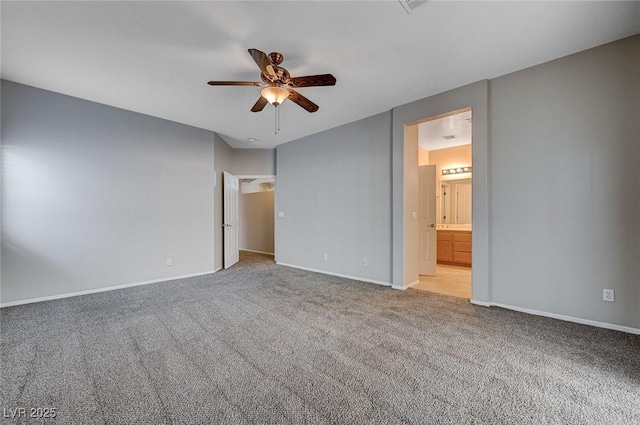 10518 Santerno St, Las Vegas, NV 89141 - unfurnished bedroom with light carpet, baseboards, ceiling fan, and connected bathroom