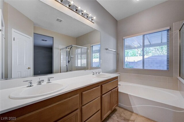 10518 Santerno St, Las Vegas, NV 89141 - full bath with a garden tub, a stall shower, double vanity, and tile patterned floors
