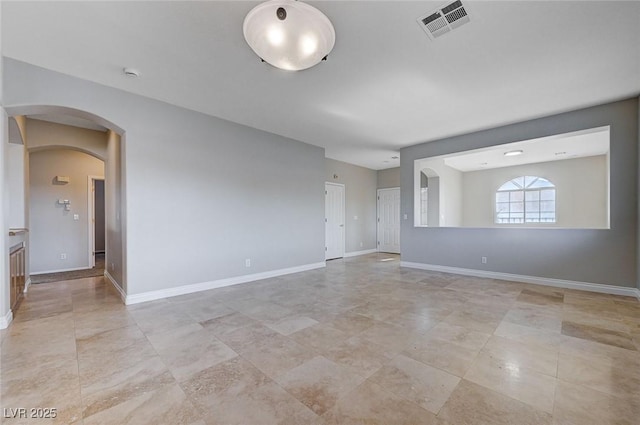 10518 Santerno St, Las Vegas, NV 89141 - unfurnished room featuring arched walkways, baseboards, and a smoke detector