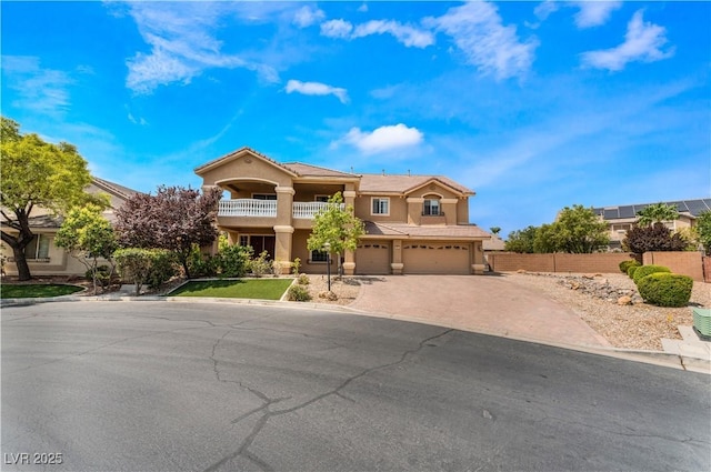5872 Revital Ct, Las Vegas, NV 89131 - mediterranean / spanish-style home featuring decorative driveway, a balcony, a garage, and stucco siding