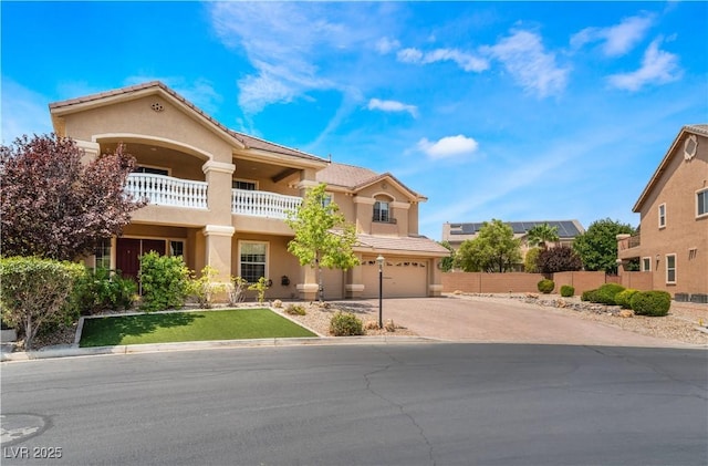 5872 Revital Ct, Las Vegas, NV 89131 - mediterranean / spanish-style home featuring concrete driveway, an attached garage, and stucco siding