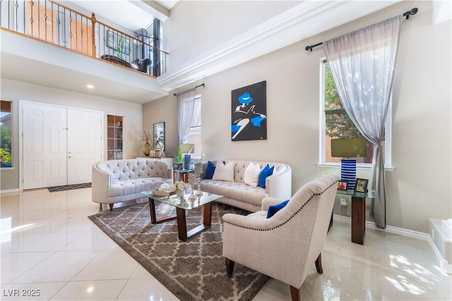 5872 Revital Ct, Las Vegas, NV 89131 - living area with baseboards, a towering ceiling, tile patterned floors, and recessed lighting