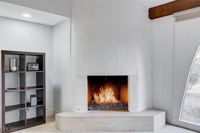 945 Vegas Valley Dr, Las Vegas, NV 89109 - detailed view of a high end fireplace and wood finished floors