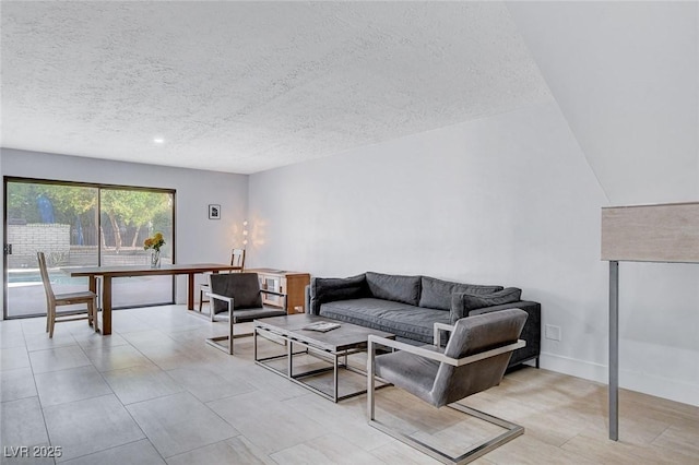 945 Vegas Valley Dr, Las Vegas, NV 89109 - living room featuring a textured ceiling