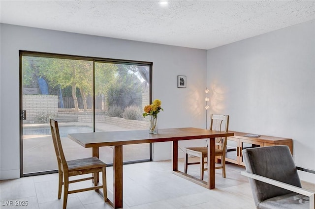 945 Vegas Valley Dr, Las Vegas, NV 89109 - dining space with plenty of natural light, a textured ceiling, and recessed lighting